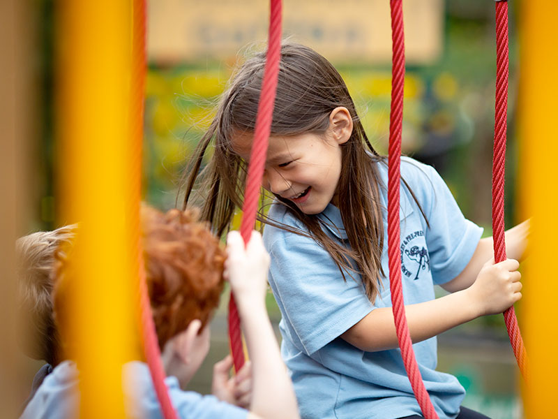 Girl balancing on ropes